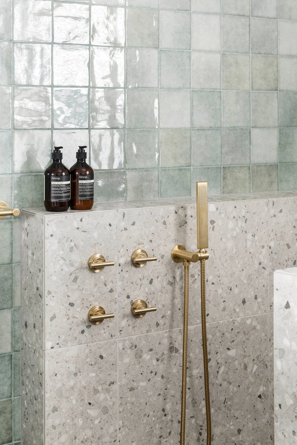 A custom designed bathroom featuring terrazzo tiles. Designed and built by MJ Harris Group. #MJHxOrrrongCt