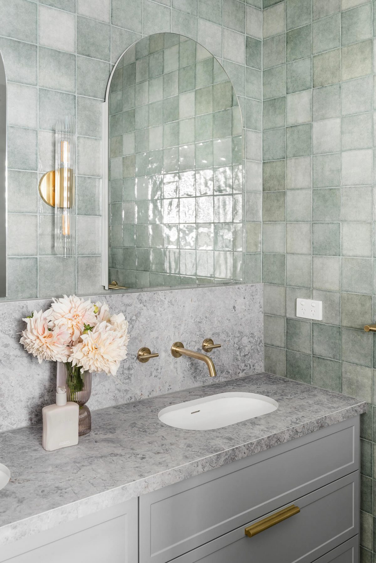 A custom designed bathroom featuring green tiles. Designed and built by MJ Harris Group. #MJHxOrrrongCt