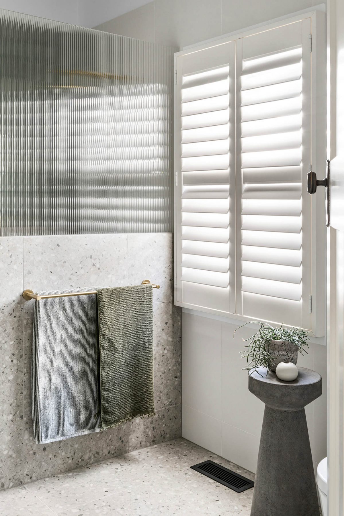 A custom designed bathroom featuring terrazzo tiles. Designed and built by MJ Harris Group. #MJHxOrrrongCt