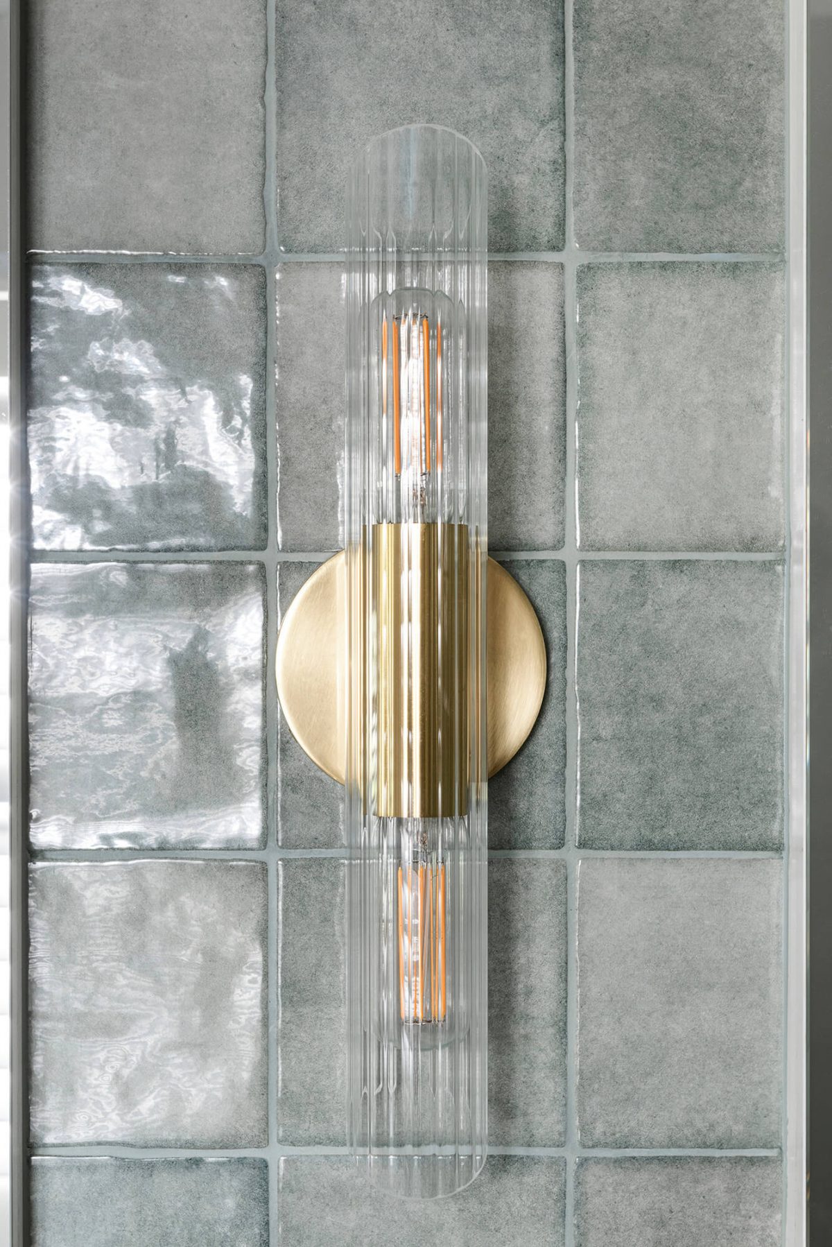 A custom designed bathroom featuring a feature light. Designed and built by MJ Harris Group. #MJHxOrrrongCt