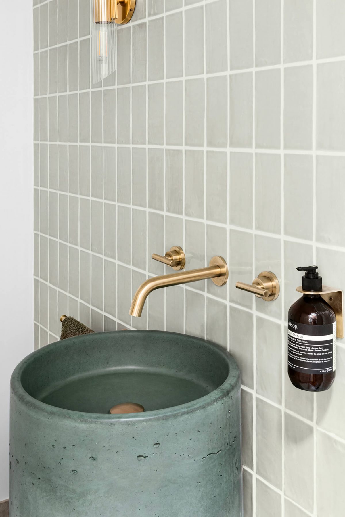 A custom designed bathroom featuring a green basin. Designed and built by MJ Harris Group. #MJHxOrrrongCt