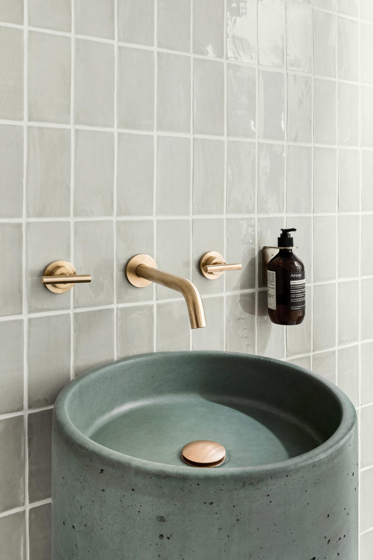 A custom designed bathroom featuring a green basin. Designed and built by MJ Harris Group. #MJHxOrrrongCt