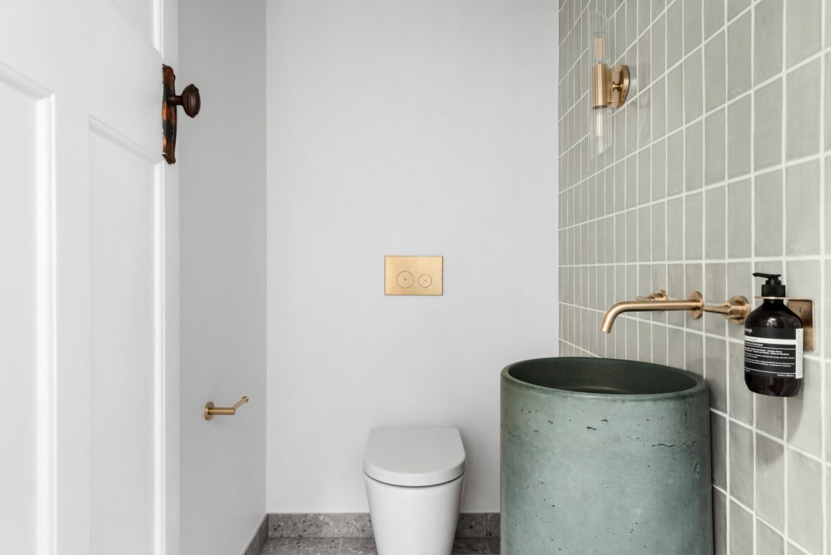 A custom designed bathroom featuring a green basin. Designed and built by MJ Harris Group. #MJHxOrrrongCt