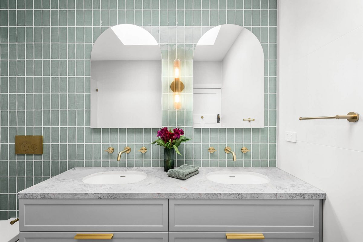 A custom designed bathroom featuring green joinery. Designed and built by MJ Harris Group. #MJHxOrrrongCt