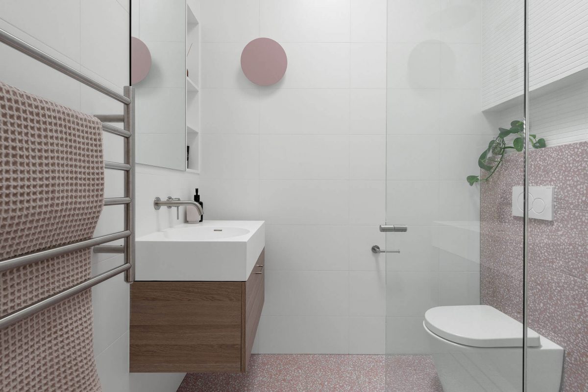 A custom designed bathroom featuring pink tiles. Designed and built by MJ Harris Group. #MJHxKeonSt