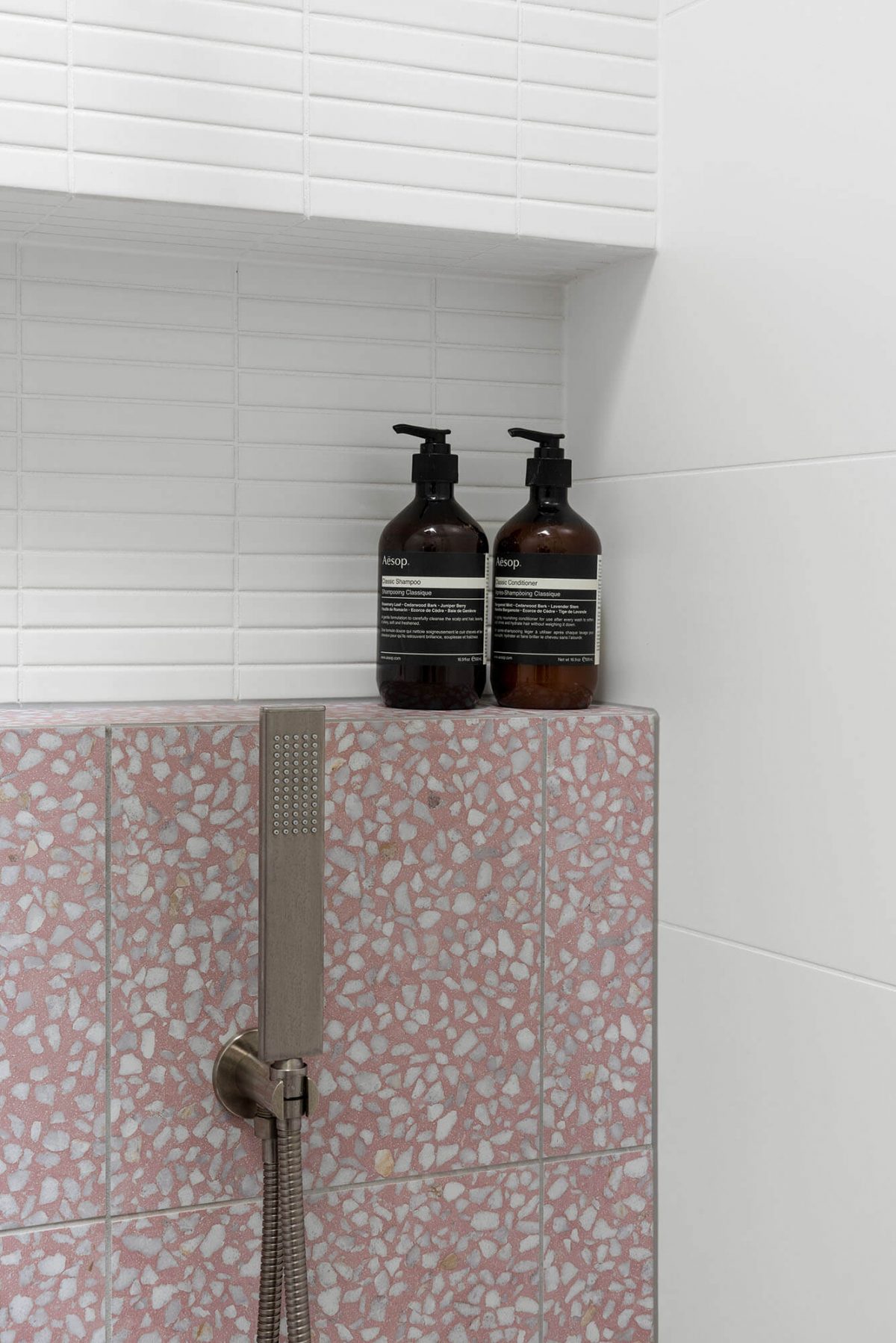 A custom designed bathroom featuring pink tiles. Designed and built by MJ Harris Group. #MJHxKeonSt