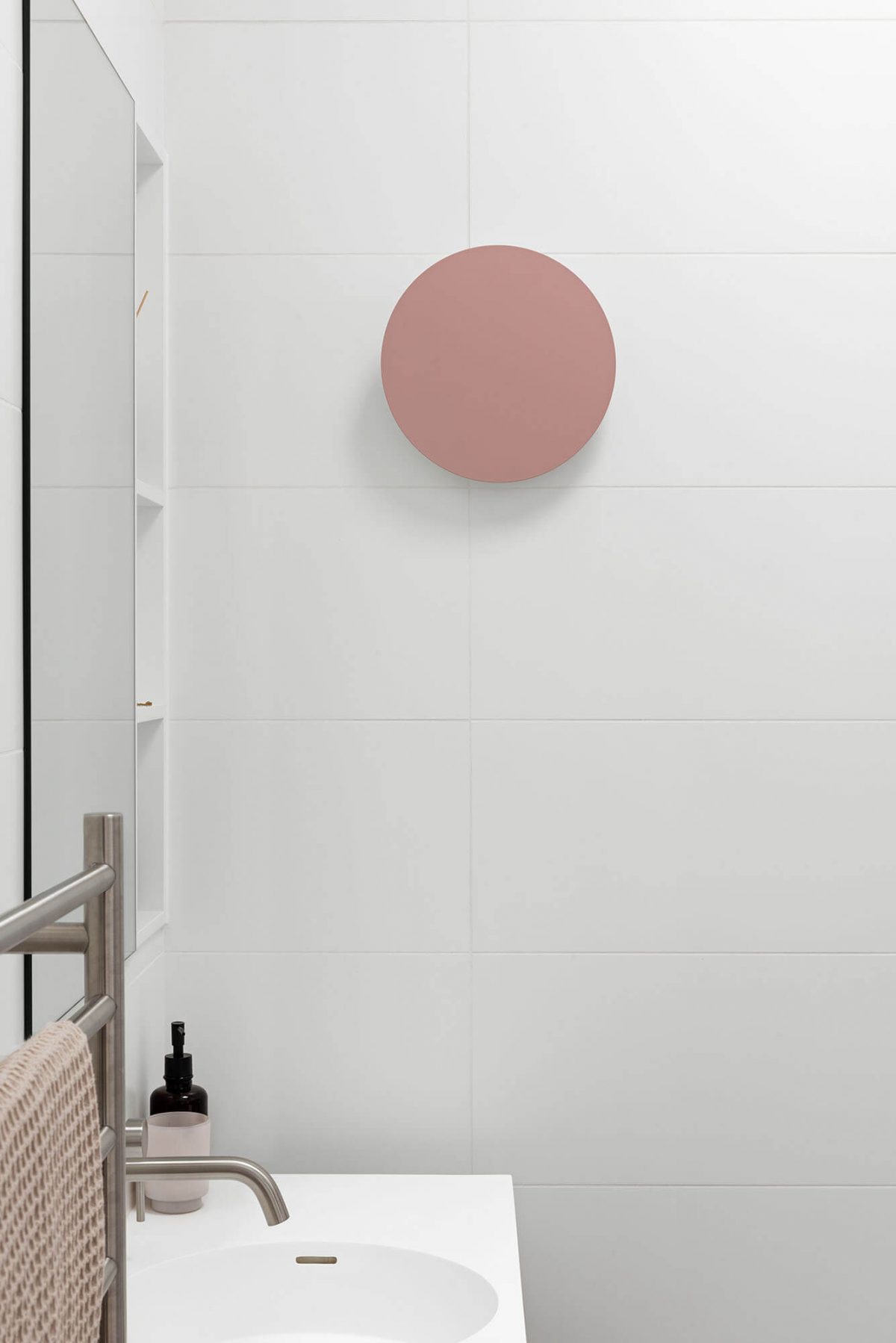 A custom designed bathroom featuring a pink light. Designed and built by MJ Harris Group. #MJHxKeonSt