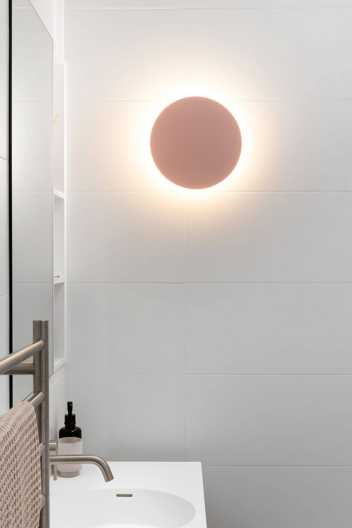 A custom designed bathroom featuring a pink light. Designed and built by MJ Harris Group. #MJHxKeonSt