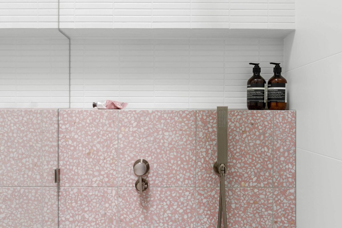 A custom designed outdoor bathroom featuring pink tiles. Designed and built by MJ Harris Group. #MJHxKeonSt