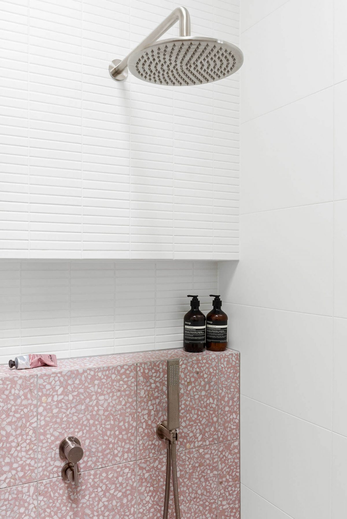 A custom designed bathroom featuring pink tiles. Designed and built by MJ Harris Group. #MJHxKeonSt