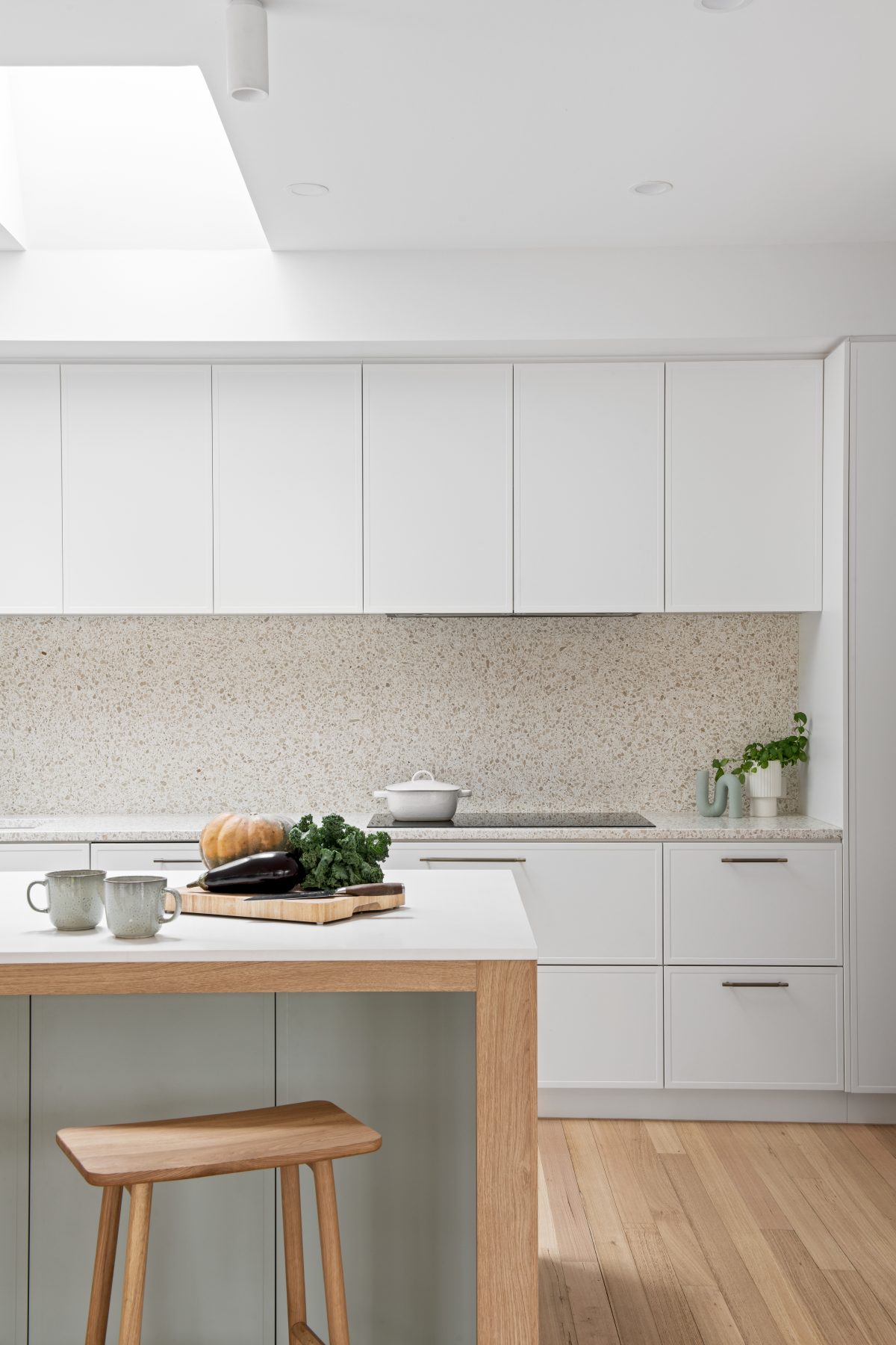 A custom designed kitchen featuring terrazzo benchtops + splashbacks and custom joinery. Designed and built by MJ Harris Group. #MJHxElthamSouth