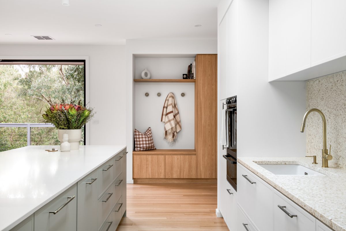 A custom designed kitchen featuring terrazzo benchtops + splashbacks and custom joinery. Designed and built by MJ Harris Group. #MJHxElthamSouth