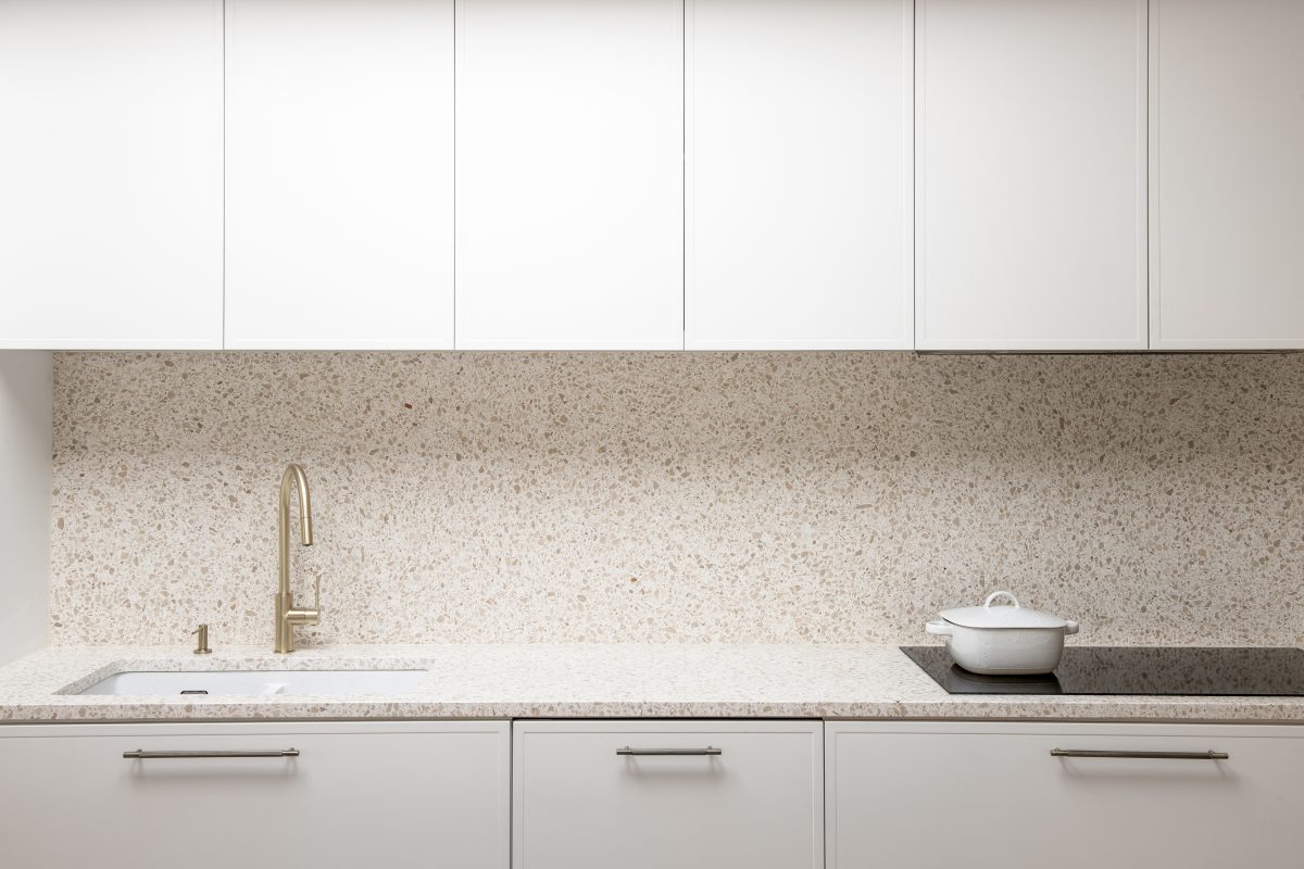 A custom designed kitchen featuring terrazzo benchtops + splashbacks and custom joinery. Designed and built by MJ Harris Group. #MJHxElthamSouth