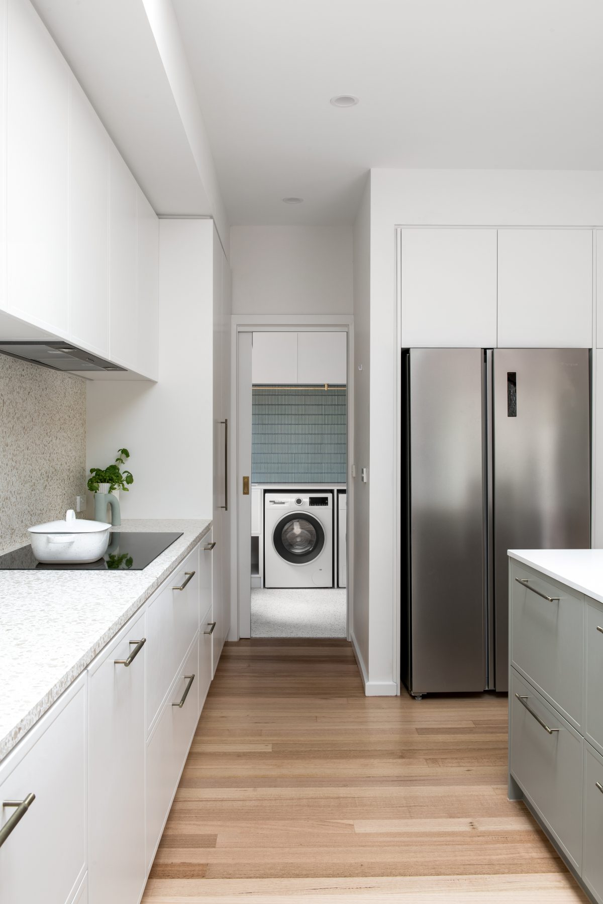 A custom designed kitchen featuring terrazzo benchtops + splashbacks and custom joinery. Designed and built by MJ Harris Group. #MJHxElthamSouth