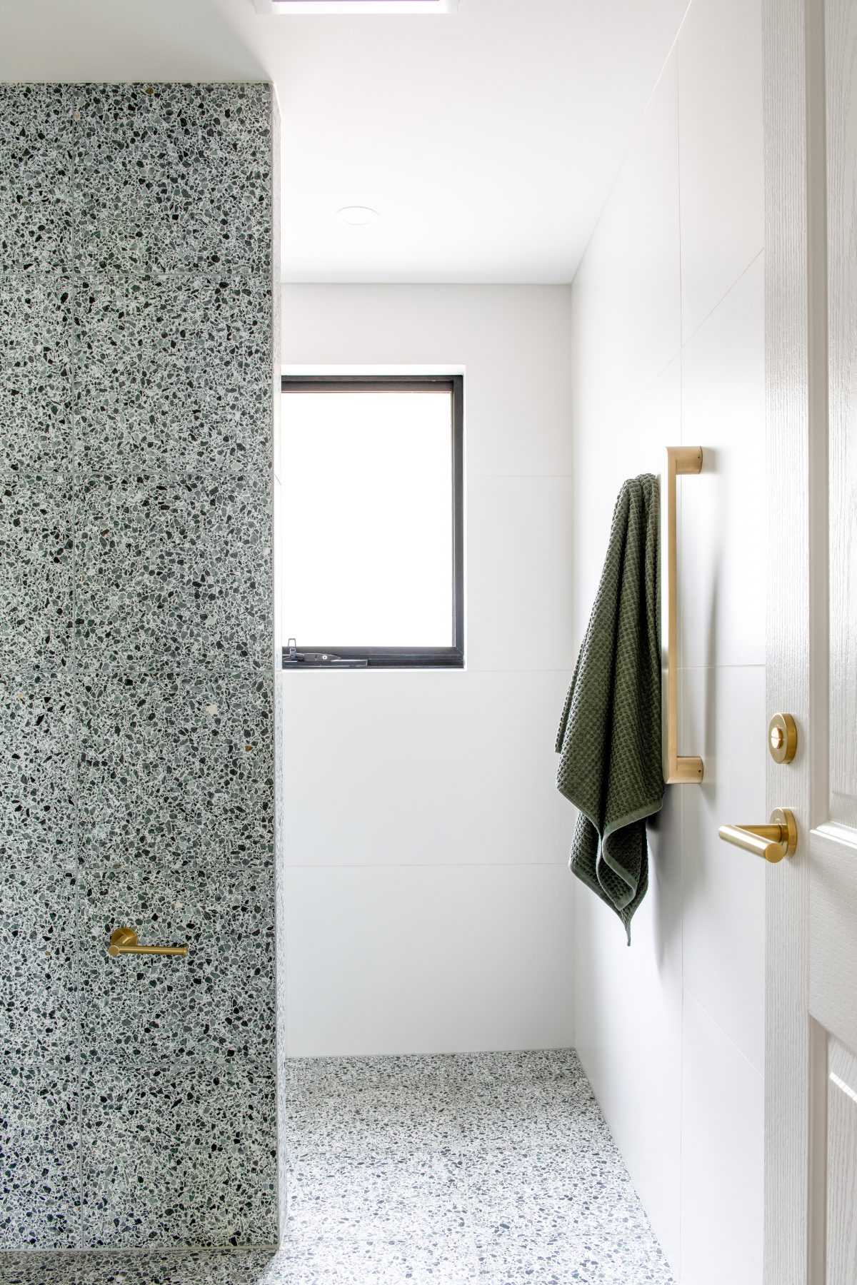 Custom bathroom featuring green terazzo tiles in Eltham. Designed and built by MJ Harris Group. #MJHxElthamSouth