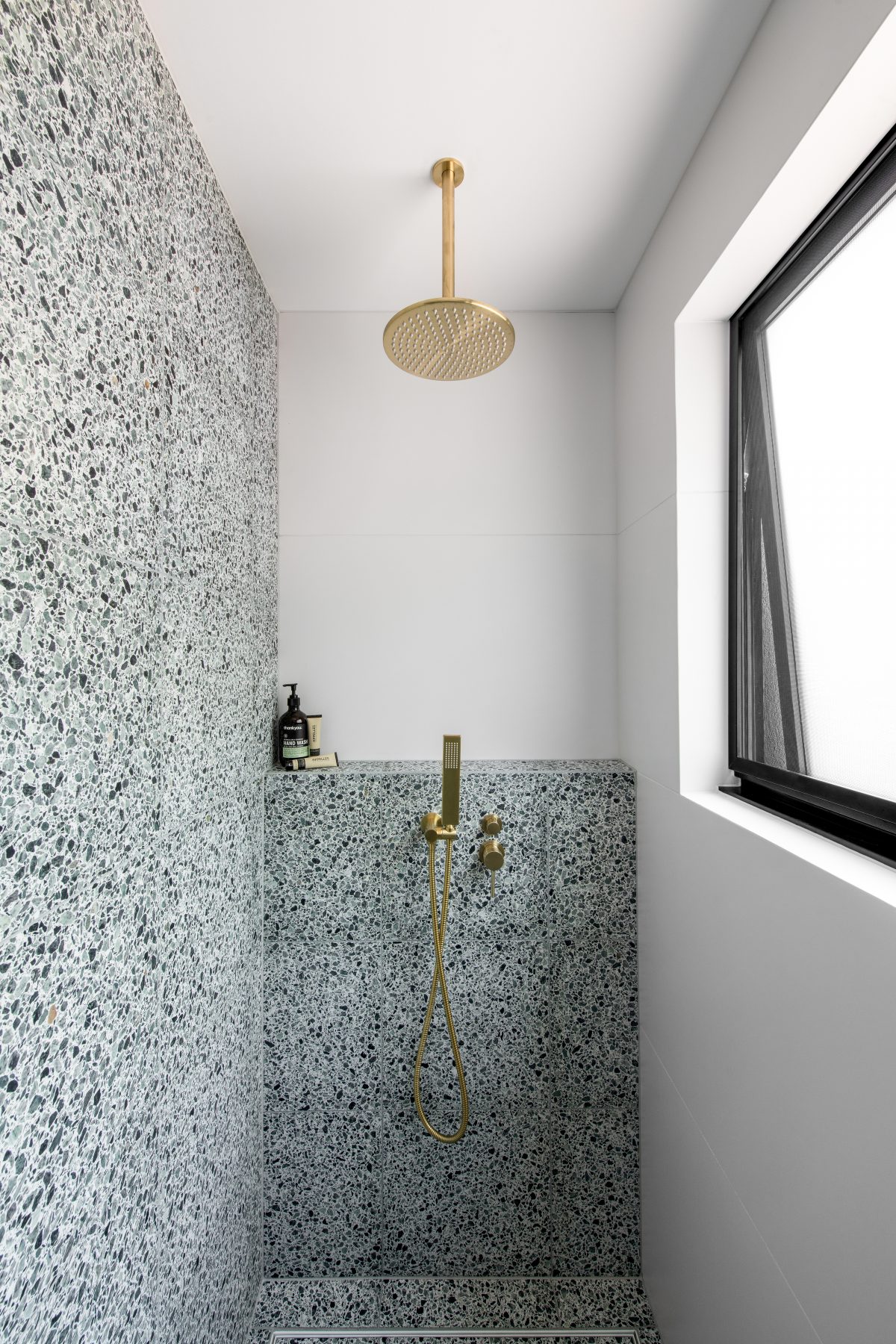 Custom bathroom featuring green terazzo tiles in Eltham. Designed and built by MJ Harris Group. #MJHxElthamSouth