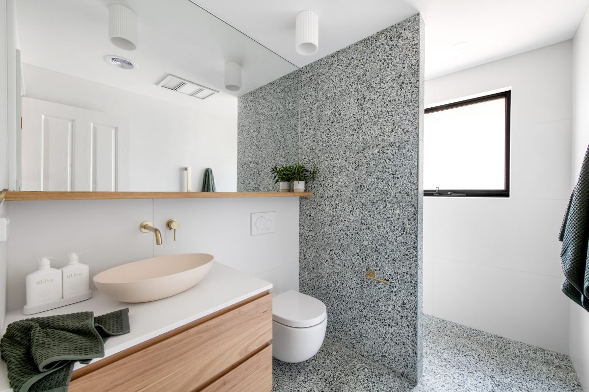 Custom bathroom featuring green terazzo tiles in Eltham. Designed and built by MJ Harris Group. #MJHxElthamSouth