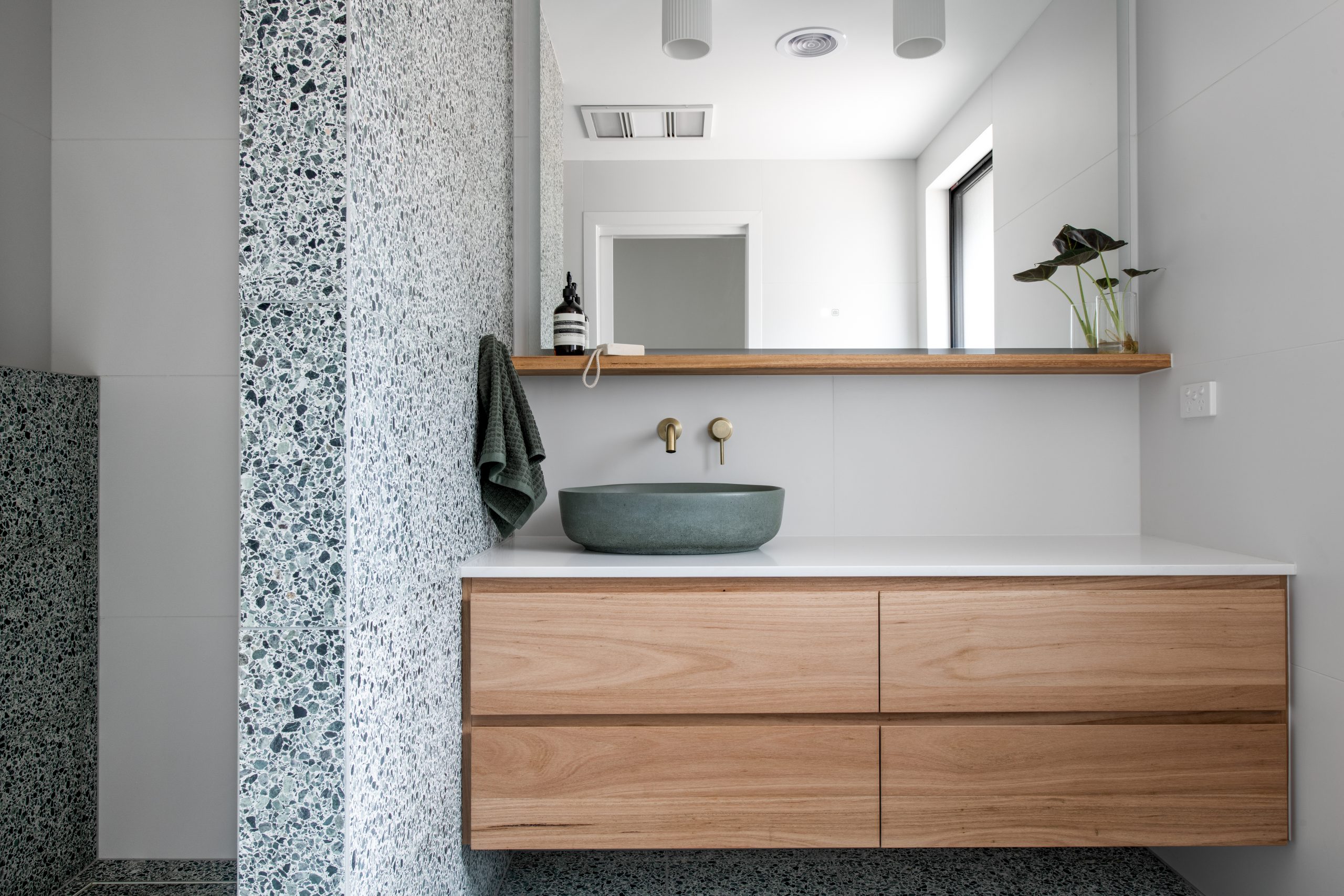 Custom bathroom featuring green terazzo tiles in Eltham. Designed and built by MJ Harris Group. #MJHxElthamSouth