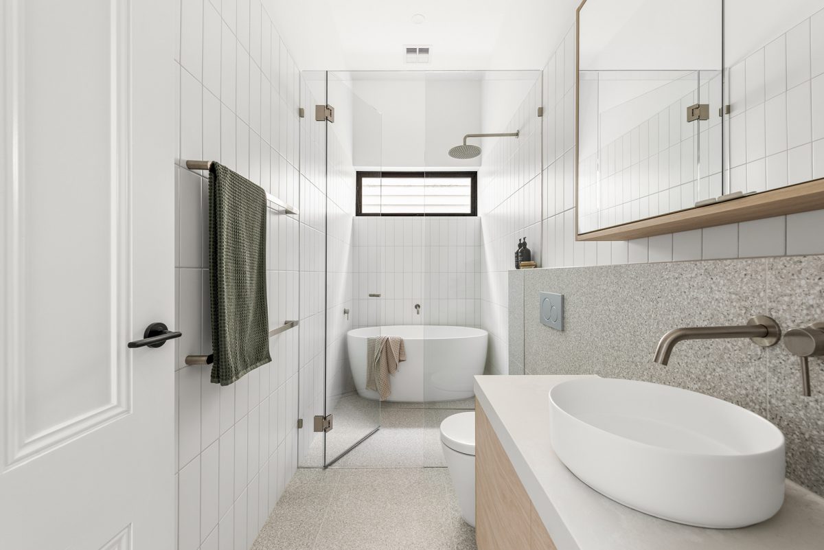 A custom designed bathroom featuring a wet room design. Designed and built by MJ Harris Group. #MJHxAlbionSt