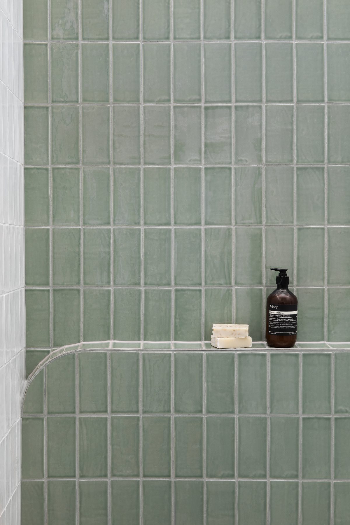 A custom designed bathroom featuring Spanish Handmade Sage Gloss tiles. Designed and built by MJ Harris Group. #MJHxValentineGrove