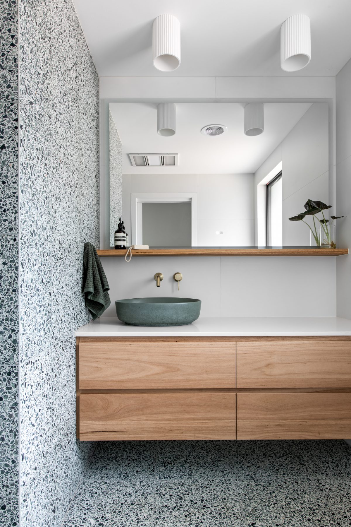 Custom bathroom featuring green terazzo tiles in Eltham. Designed and built by MJ Harris Group. #MJHxElthamSouth