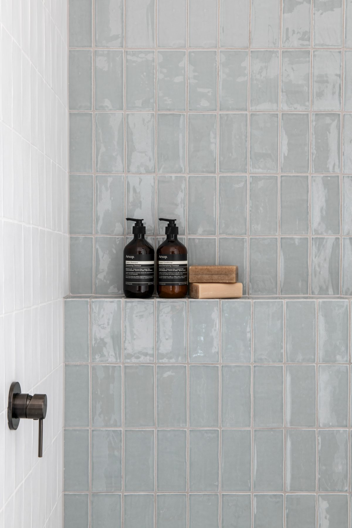 A custom designed bathroom featuring Spanish handmade look tiles. Designed and built by MJ Harris Group.