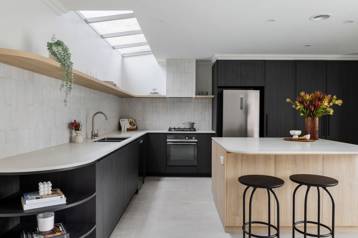 A custom designed kitchen featuring splashback tiles and contemporary curves. Designed and built by MJ Harris Group. #MJHxAndrewSt