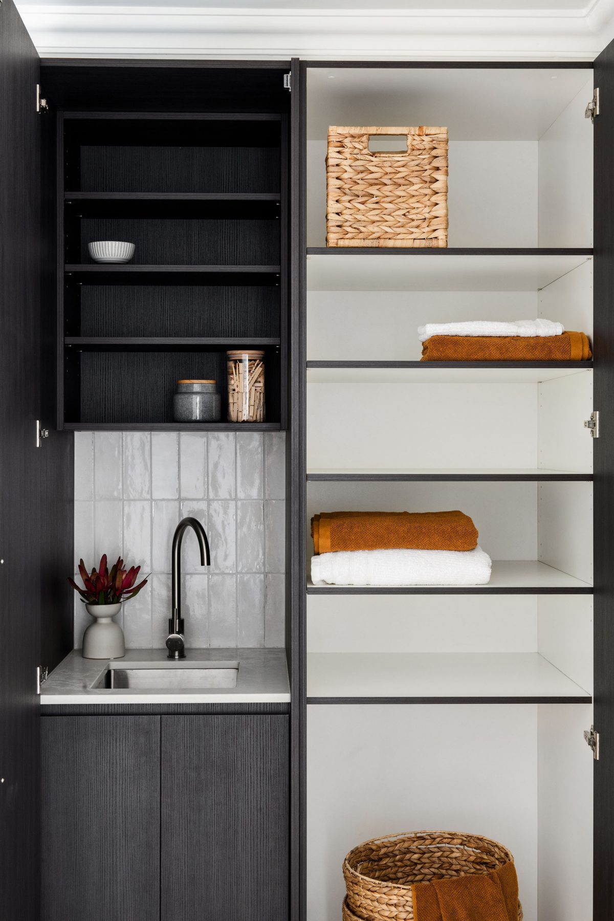 A custom designed laundry featuring beige terrazzo. Designed and built by MJ Harris Group. #MJHxAndrewSt