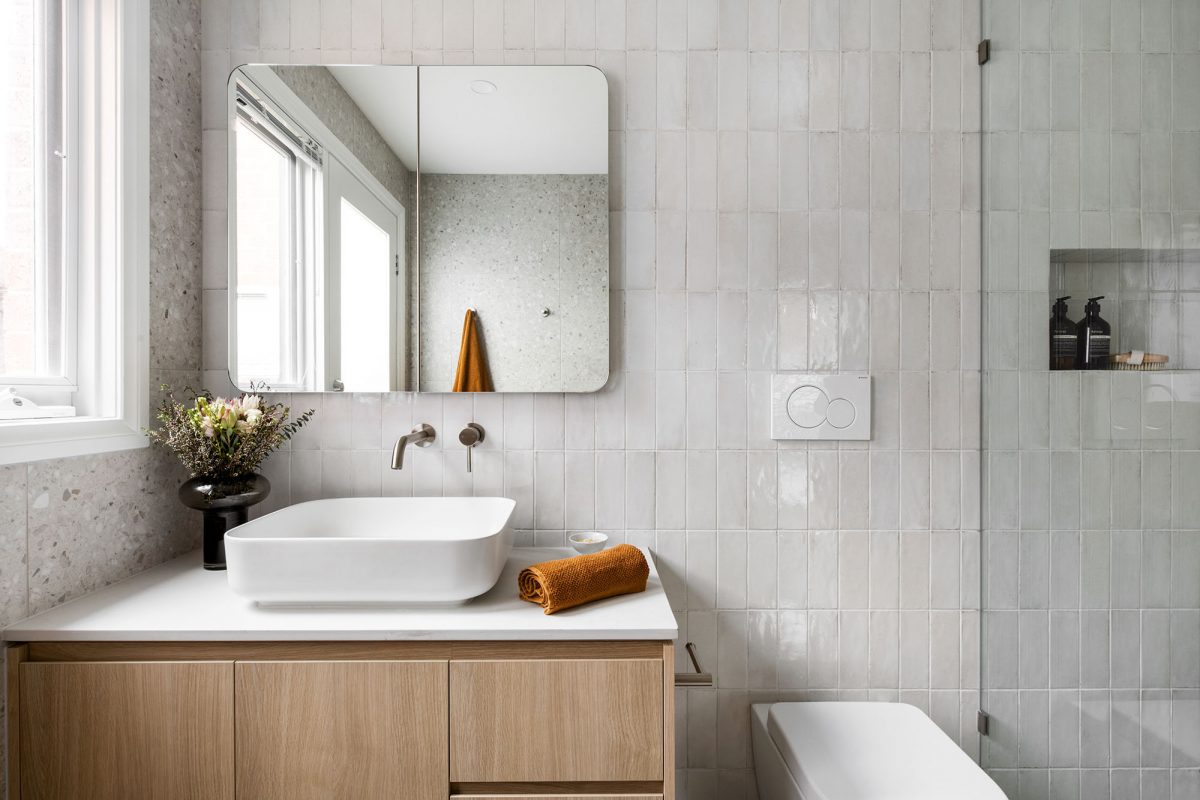 A custom designed bathroom featuring beige terrazzo. Designed and built by MJ Harris Group. #MJHxAndrewSt