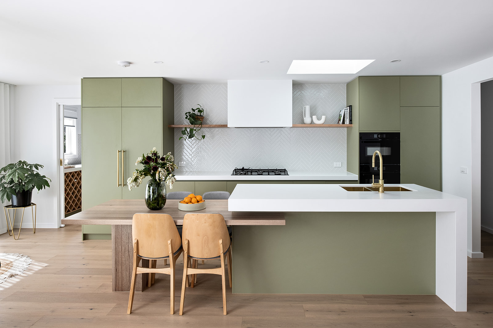 A custom designed kitchen featuring green joinery. Designed and built by MJ Harris Group. #MJHxMardenSt